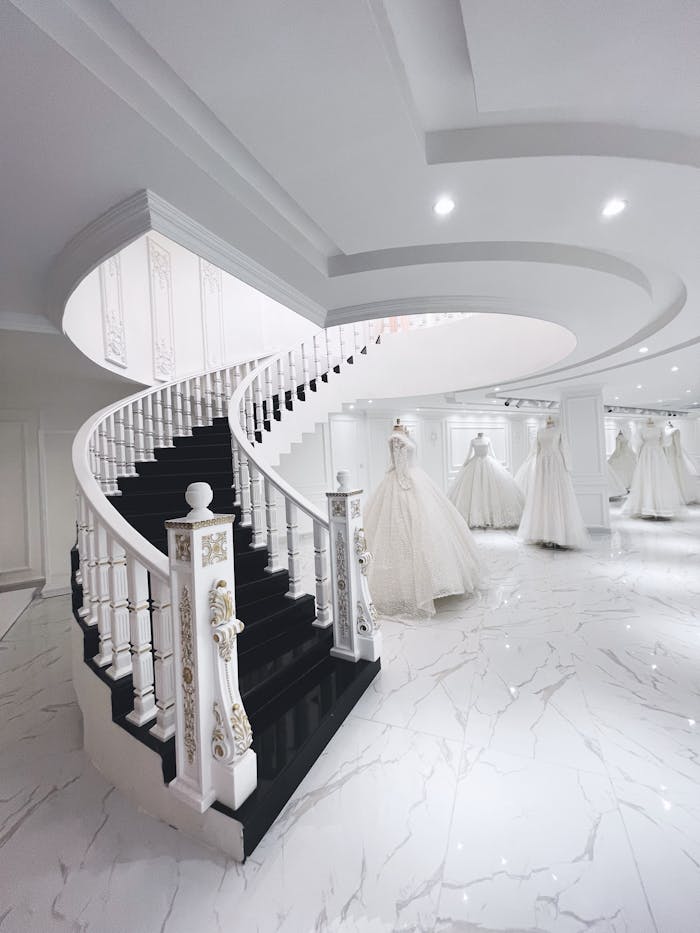 elegant-bridal-shop-interior-with-spiral-staircase-35001716