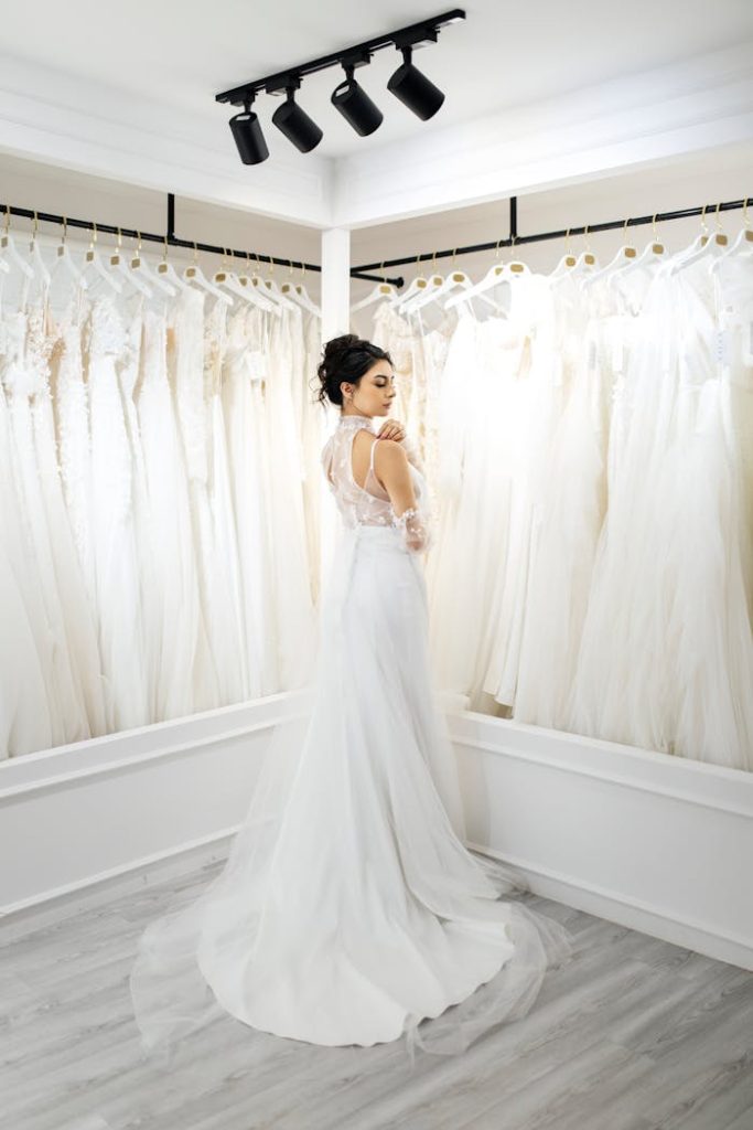 A stunning bride in a modern bridal shop, showcasing a beautiful wedding dress.